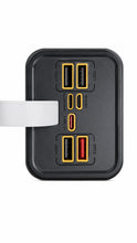 A black multi-port USB charger with the various ports
