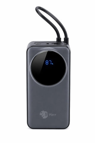 A dark gray rectangular portable power bank with a circular black display